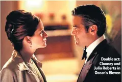  ??  ?? Double act: Clooney and Julia Roberts in Ocean’s Eleven