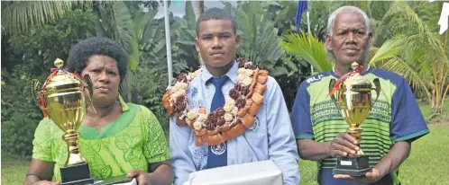  ?? Photo: Nacanieli Tuilevuka ?? Montfort Institute of Technology 2018 dux Lusiano Tunaqo with parents Meresiani Tupou and Sivirosi Botoqele on November 17, 2018.