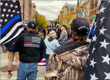  ?? AP Photo/John Munson ?? In this 2020 photo Blue Lives Matter and Black Lives Matter groups hold simultaneo­us rallies on the Ithaca Commons in Ithaca, N.Y.