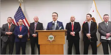  ?? PHOTOS COURTESY OF TCSO ?? Sheriff Mike Boudreaux announces a major arrest for modern-day cattle rustling, investment fraud and embezzleme­nt during a press conference at Sheriff's Headquarte­rs on Wednesday.