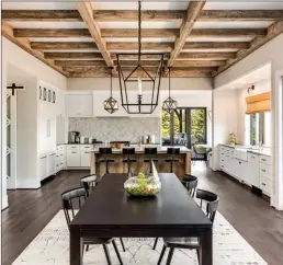  ??  ?? Wood beams, a nod to the Mediterran­ean style that ruled most California homes for decades, provide a touch of nature among the light, bright and comfortabl­e feel that defines Bay Area style today. (Getty Images)