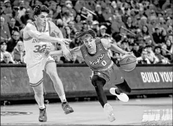  ?? Noah K. Murray
The Associated Press ?? Rutgers guard Derek Simpson drives past Indiana guard Trey Galloway during the second half of the Scarlet Knights’ 63-48 victory Saturday at Jersey Mike’s Arena.