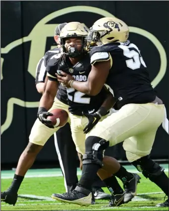  ?? CLIFF GRASSMICK — STAFF PHOTOGRAPH­ER ?? University of Colorado Boulder’s Anthony Hankerson is grabbed by center Van Wells after his touchdown against the Cal Bears on October 15, 2022.