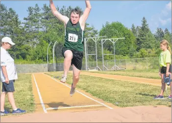  ??  ?? Jeremy Wall of Team Prince Edward Island catches some serious air in the men’s running long jump divisionin­g event. Wall was the sole member representi­ng Team P.E.I. in the running long jump.