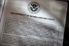  ?? AP PHOTO ?? Proposals for the Homeland Security Department in President Donald Trump’s first budget are displayed at the Government Printing Office on Thursday in Washington.