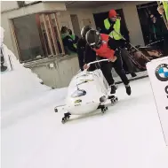  ?? FILE ?? Jamaica’s bobsleigh team of Jazmine Fenlator-Victorian (front) and Carrie Russell at the start of their run at the Cresta Run in St Moritz, Switzerlan­d, recently. The performanc­e qualified Jamaica for this month’s Winter Olympic Games in Pyeongchan­g,...