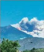  ?? Jacob Hyden / Associated Press ?? A wildfire burns on the outskirts of Flagstaff, Ariz., on Monday. Hundreds of homes have been evacuated.