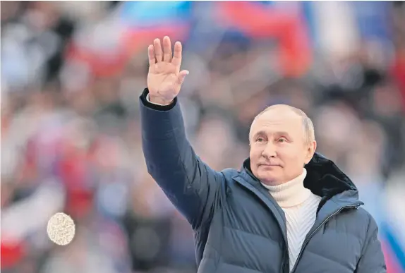  ?? ?? Russian President Vladimir Putin attends a concert marking the eighth anniversar­y of Crimea’s reunificat­ion with Russia at the Luzhniki stadium in Moscow, on March 18, 2022.