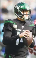  ?? Steven Ryan / Associated Press ?? Jets quarterbac­k Sam Darnold (14) drops back to pass against the Giants on Sunday.