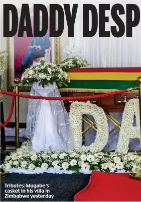  ??  ?? Tributes: Mugabe’s casket in his villa in Zimbabwe yesterday