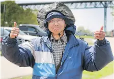  ??  ?? Marco Chung of Markham gives two thumbs up for the fishing conditions.