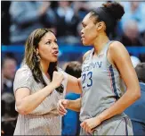 ?? SEAN D. ELLIOT/ THE DAY ?? UConn assistant coach Marisa Moseley, left, has some advice for Azurá Stevens coming out of a timeout Sunday against Notre Dame during a game at the XL Center in Hartford. UConn plays at DePaul today.
