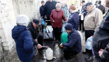 ?? ?? Kherson’s residents draw water in recently recaptured city amid Russia’s invasion of Ukraine.
