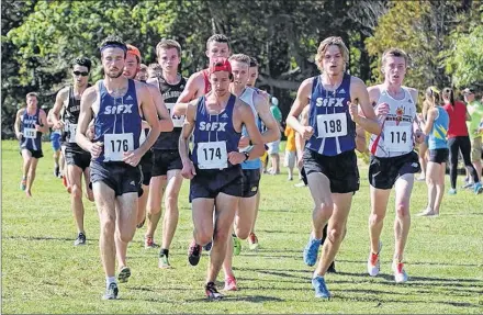 ?? PHOTO COURTESY OF ALEX CYR ?? Alex Cyr, No. 174, runs with his St. Francis Xavier teammates in a cross-country event during the 2016 season. Cyr recently wrote a book chroniclin­g the team’s season from the first day of training camp to the final day at nationals.