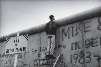  ??  ?? The Berlin Wall, November 1989; photograph by Raymond Depardon