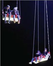  ??  ?? Stuck: Youngsters in their seats 65ft off the ground