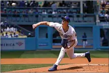  ?? MARK J. TERRILL / AP ?? Los Angeles Dodgers starting pitcher Walker Buehler throws to the plate during the first inning of a baseball game against the Detroit Tigers Sunday in Los Angeles.