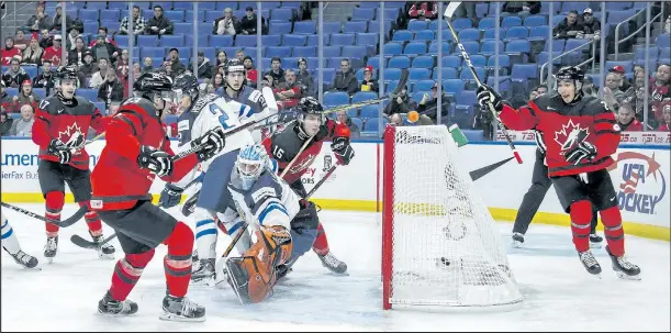  ?? THE CANADIAN PRESS ?? Sam Steel scores on Finland’s Ukko-Pekka Luukkonen in Buffalo last night as Canada opened the world junior tournament with a 4-2 victory over Finland.