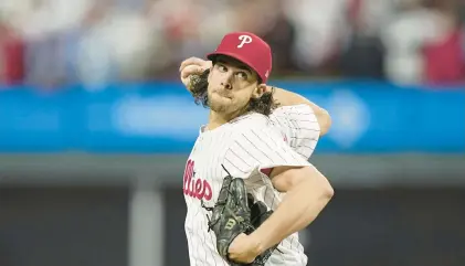  ?? BRYNN ANDERSON/AP PHILLIES ?? Phillies starting pitcher Aaron Nola throws against the Arizona Diamondbac­ks during the first inning of Game 2 of the NLCS Tuesday night in Citizens Bank Park.