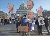  ?? MATT ROURKE/AP FILE ?? Protesters demonstrat­e Monday ahead of Pennsylvan­ia’s 58th Electoral College at the state Capitol in Harrisburg.