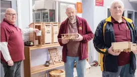  ??  ?? Left: Showcasing some of the creativity from Drouin Men’s Shed members during are (from left) secretary David Mudge, Bill Hall and president James Hunt.