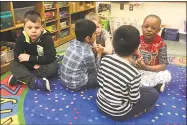  ??  ?? Kindergart­ners in Lorrie Tine’s room take part in Choose Love exercises. The children shared what they felt gratitude for.