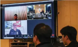  ?? ?? Members of the Korean FA technical committee attend a meeting with Jürgen Klinsmann (bottom left), who attended via a video link from his home in the US. Photograph: Getty Images