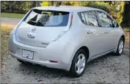  ??  ?? The 2012 Nissan Leaf looks traditiona­l and futuristic.