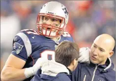  ?? By Stephan Savoia, AP ?? Big target: Rob Gronkowski, who had 17 touchdown catches in the regular season, is helped off the field after injuring his left ankle in the AFC title game.