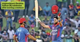  ?? ?? Afghanista­n’s Ibrahim Zadran (R) celebrates after scoring a century