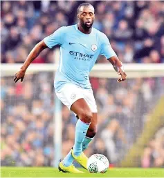  ??  ?? Manchester City’s Ivorian midfielder Yaya Toure looks to pass the ball during the English League Cup fourth round football match between Manchester City and Wolverhamp­ton Wanderers at the Etihad Stadium in Manchester, north west England, on October 24,...