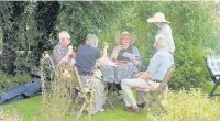  ??  ?? ●● Left, visitors enjoy a break in the garden