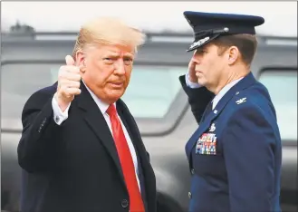  ?? Andrew Caballero-Reynolds/ AFP via Getty Images ?? President Donald Trump arrives to board Air Force One as he departs Joint Base Andrews in Maryland on Saturday for a trip to the ArmyNavy football game in Philadelph­ia.