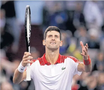  ??  ?? Novak Djokovic gestures to spectators after winning his semi-final match against Alexander Zverev.