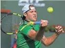  ?? MARK J. TERRILL/AP ?? Jack Sock returns a shot to Kei Nishikori at the BNP Paribas Open Friday in Indian Wells, Calif.