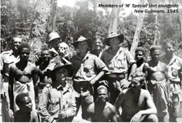  ??  ?? Members of ‘M’ Special Unit alongside New Guineans, 1945