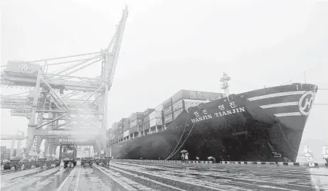  ?? AFP / Getty Images ?? A container vessel of bankrupt Hanjin Shipping is docked Friday at a terminal of the South Korean port of Busan.