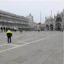  ??  ?? Police officers patrol a virtually deserted St. Mark’s Square, Venice after a decree orders for the whole of Italy to be on lockdown.