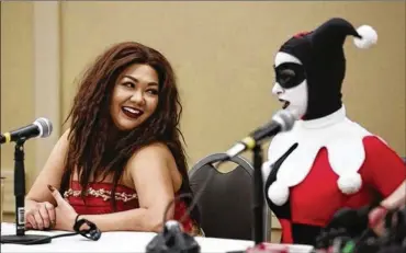  ?? FRED SQUILLANTE/THE COLUMBUS DISPATCH ?? The recent Ohayocon, an anime convention held in Columbus, included a discussion of sexual harassment featuring panel members Michelle Mussoni, who goes by the name Mogchelle, of Indianapol­is, and Lauren Brandt of St. Louis (outfitted as Batman villain...