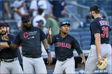  ?? EDUARDO MUNOZ ALVAREZ — THE ASSOCIATED PRESS ?? Jose Ramirez celebrates with teammates after the Indians’ victory Sept. 19in New York.