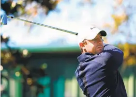  ?? MIKE EHRMANN GETTY IMAGES ?? Rory McIlroy, who shot a 6-under 66, plays his shot from the second tee during the first round of the Arnold Palmer Invitation­al at the Bay Hill Club on Thursday.