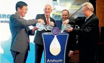  ??  ?? From left: Beingmate chairman Wang Zhentai, Fonterra CEO Theo Spierings, former prime minister John Key and China Dairy Industry Associatio­n chairman Song Kungang at the 2015 signing of a memorandum of understand­ing.