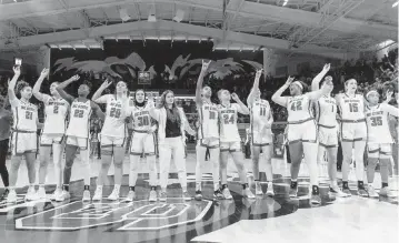  ?? TRAVIS LONG tlong@newsobserv­er.com ?? The NC State’s women’s basketball team celebrates a win against Chattanoog­a during during the first round of the NCAA Women’s Tournament at Reynolds Coliseum in Raleigh on March 23, 2024. N.C. State won 64-45.