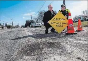  ?? BOB TYMCZYSZYN THE ST. CATHARINES STANDARD ?? CAA Niagara president and CEO Peter Van Hezewyk and Niagara Regional Police Staff-Sgt. Rome Diegidio at the launch of CAA’s Worst Roads campaign.