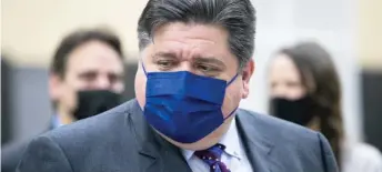  ?? SCOTT P. YATES/ROCKFORD REGISTER STAR VIA AP ?? Gov. J.B. Pritzker tours a vaccinatio­n site with local and state lawmakers and county health leaders in Rockford last month.