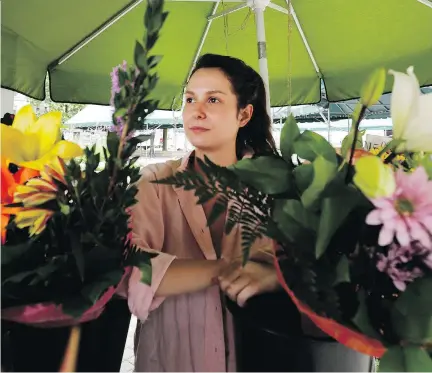  ?? ALLEN McINNIS ?? Flower vendor Lioudmila Zoueva says she has been left disillusio­ned by the process that led to her pending eviction from the Phillips Square kiosk. “I thought I was settled, but now I have to restart everything,” she says.