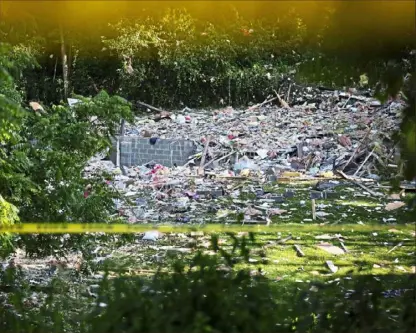  ?? Jessie Wardarski/ Post- Gazette ?? The remains of a home are spread across a hill after the house exploded Wednesday afternoon in North Franklin, Washington County.