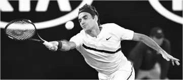  ?? — AFP photo ?? Switzerlan­d’s Roger Federer hits a return during their men’s singles third round match against France’s Richard Gasquet on day six of the Australian Open tennis tournament in Melbourne.