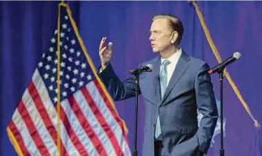  ?? Arnold Gold / Hearst Connecticu­t Media ?? Gov. Ned Lamont speaks to attendees after being sworn into office for another term last month at the Gov. William A. O’Neill Armory in Hartford.