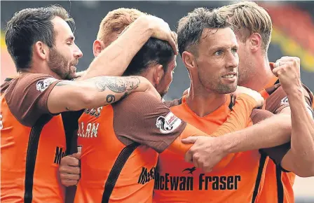  ??  ?? Scott McDonald (right) was on the mark as Dundee United beat Queen of the South 2-1 at Tannadice.